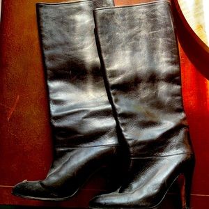 Black leather heeled knee high boots
